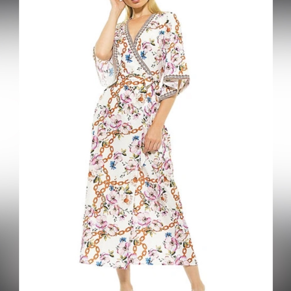 This kimono wrap dress features allover floral and chain prints.
